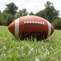 Raise money for your cheerleading team by hosting a competitive powder-puff football game.