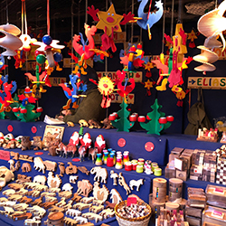 A booth full of crafts for sale, representing a craft fair fundraiser.