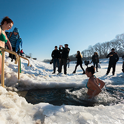 A group of people participating in a polar plunge for fundraising.