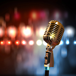 A microphone on a stage, representing talent shows as a fundraising idea.