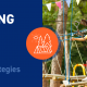 On the left side, the title of this post. On the right side, an image of happy campers completing a ropes course.