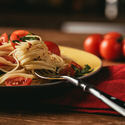 A plate of spaghetti, representing the concept of hosting a virtual cooking class as a virtual fundraising idea.